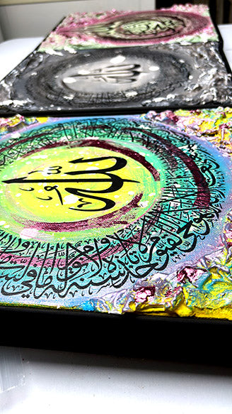 Colorful artwork with Arabic calligraphy on a white surface