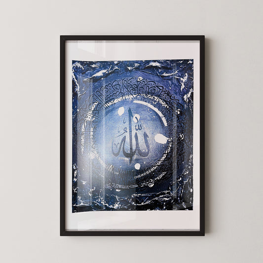 Framed artwork with a blue and black design on a white wall