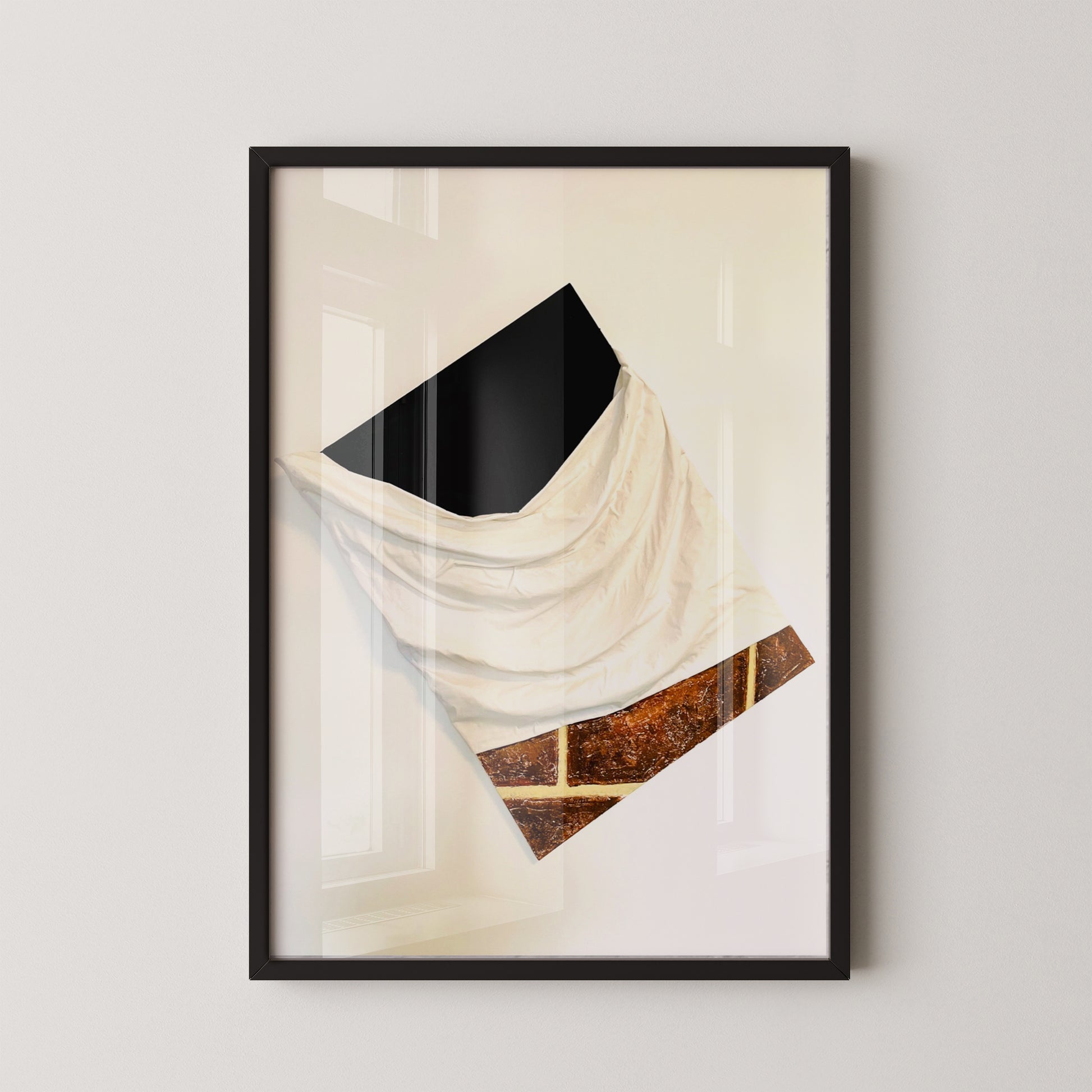 Framed abstract art print on a white wall