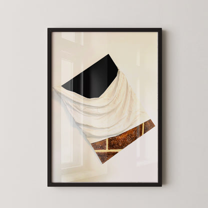 Framed abstract art print on a white wall