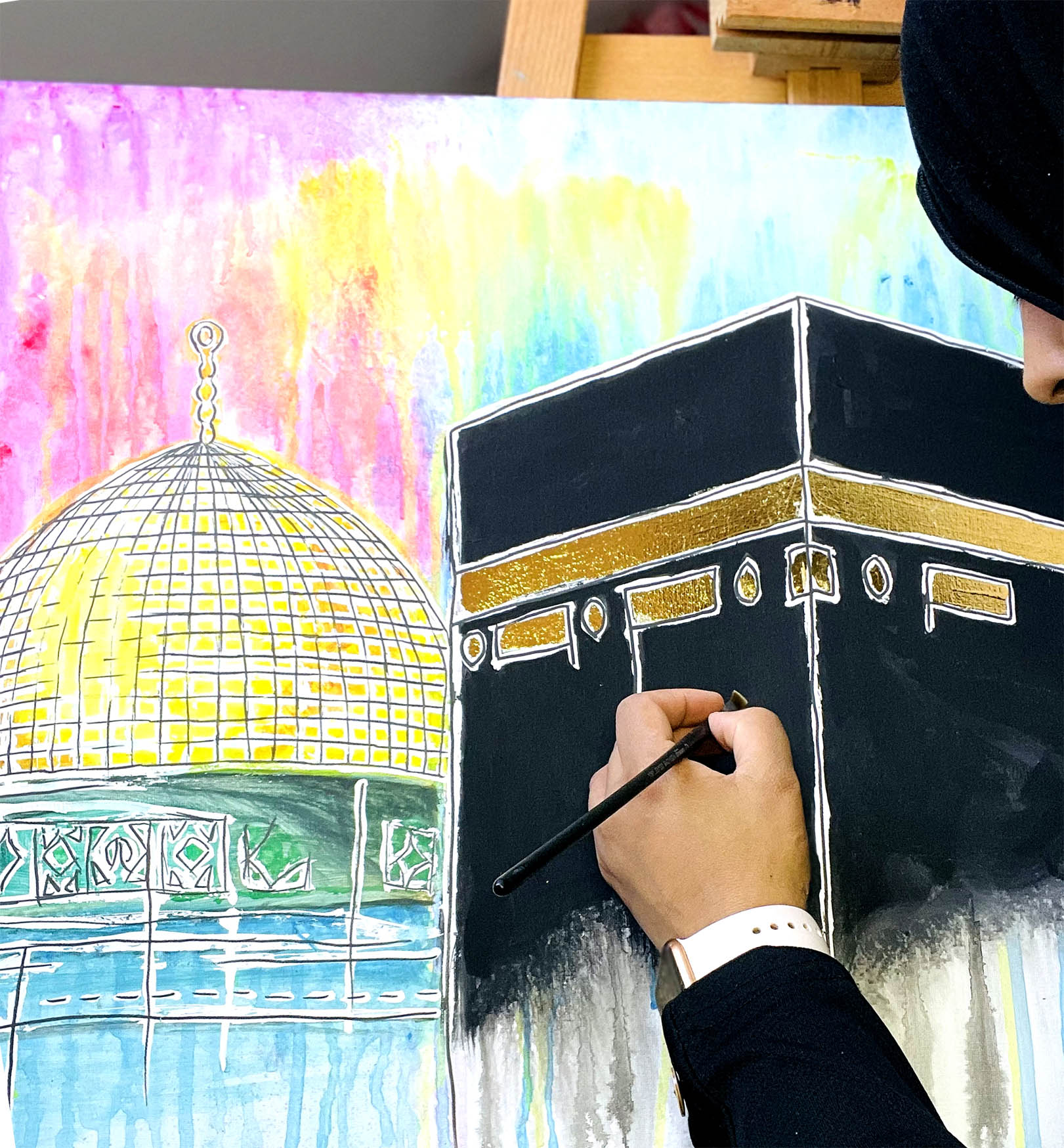 Person drawing a detailed illustration of a religious building with colorful background